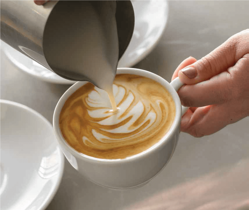 Barista pouring coffe